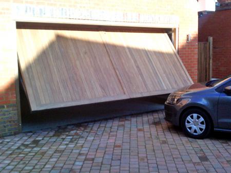 Woodrite Kenilworth Idigbo timber door installed inbetween double detached brick garage